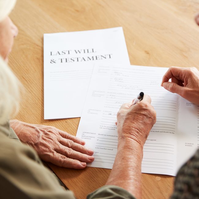 Advisor in Bonita Springs reviewing estate planning documents with clients.