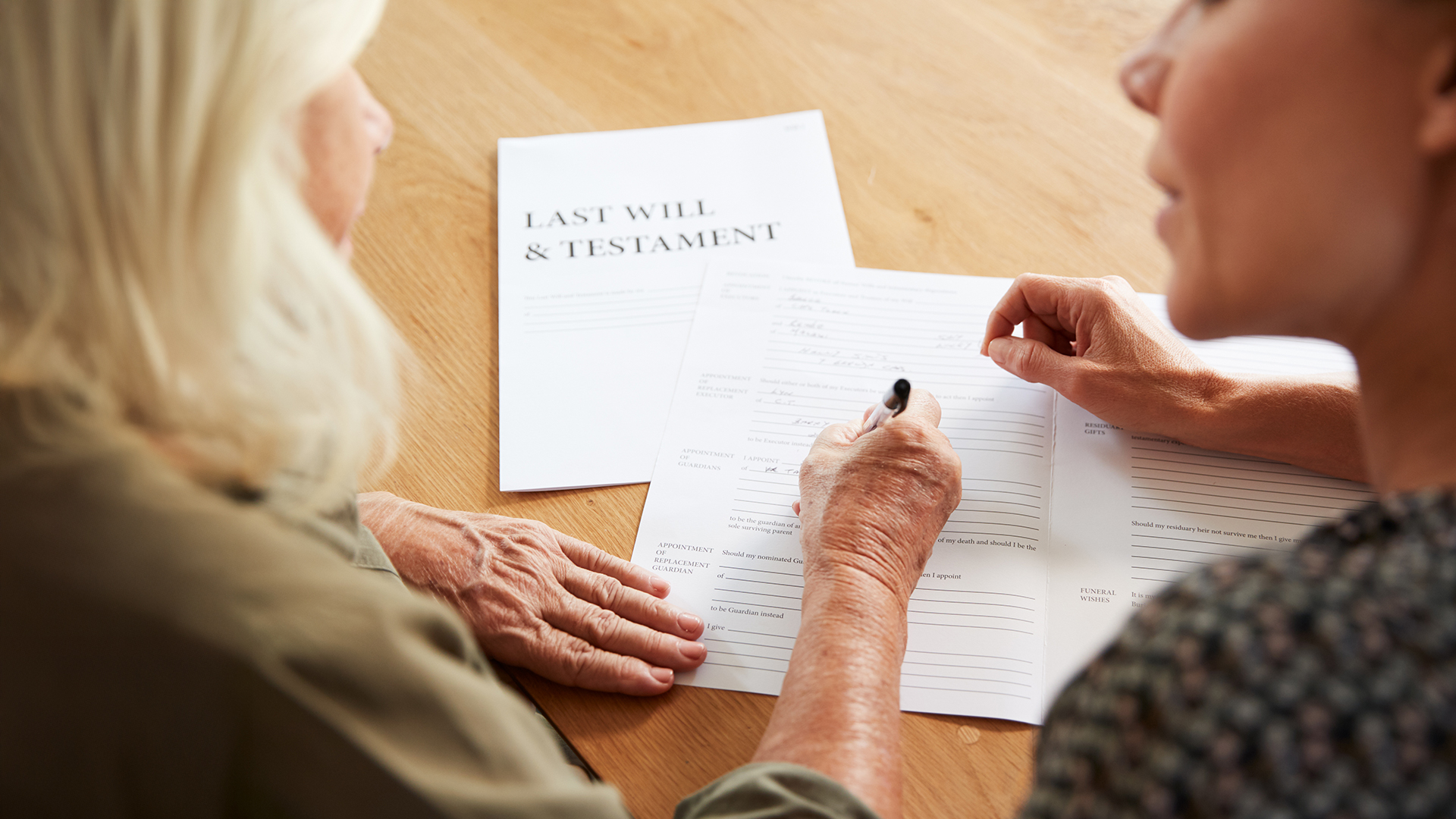 Advisor in Bonita Springs reviewing estate planning documents with clients.