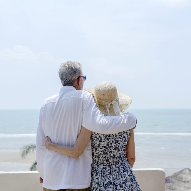 Couple in Naples, Florida meeting with financial advisor to review retirement tax benefits.