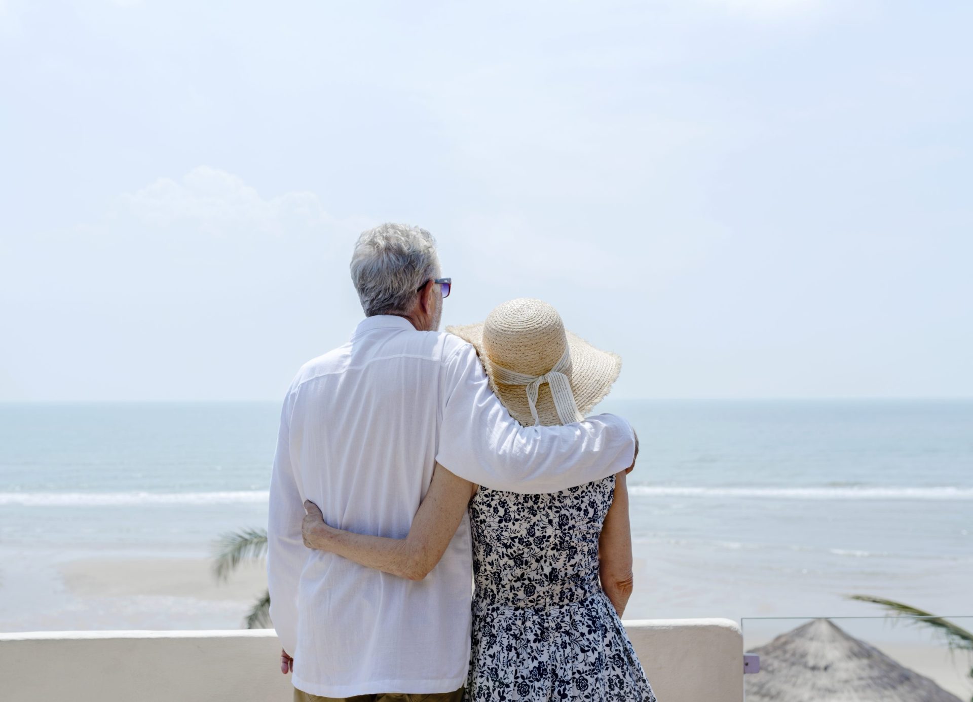 Couple in Naples, Florida meeting with financial advisor to review retirement tax benefits.