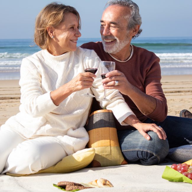 Retirees in Southwest Florida meeting with a financial advisor to review withdrawal and tax strategies.