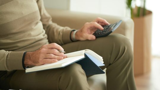 Advisor in Bonita Springs reviewing retirement tax planning strategies with clients.