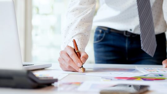 Advisor reviewing a personalized retirement tax planning strategy with clients in Southwest Florida