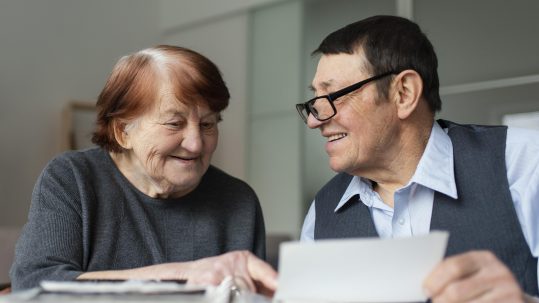 Advisor reviewing health care retirement planning steps with retirees in Southwest Florida