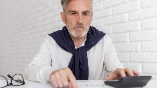 Advisor reviewing retirement investment planning stages with clients in Southwest Florida