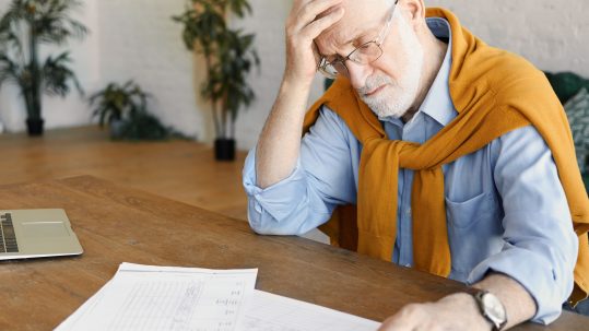 Federal retiree in Florida reviewing pension, TSP, and Social Security decisions with a financial advisor