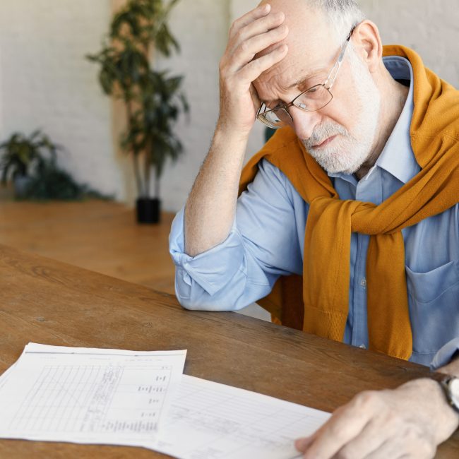 Federal retiree in Florida reviewing pension, TSP, and Social Security decisions with a financial advisor