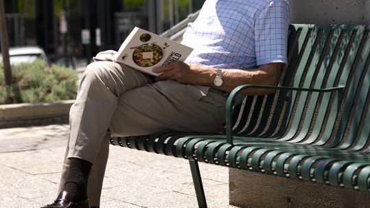 Retirees reviewing retirement income strategies during major life transitions with a financial advisor in Southwest Florida