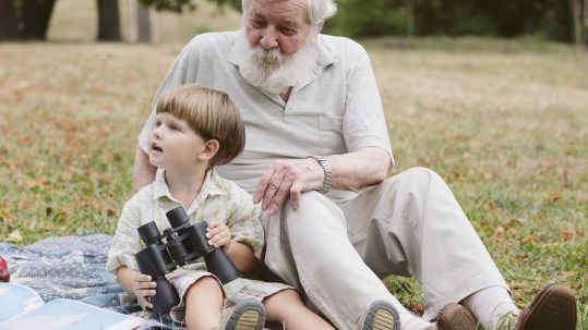 Pre-retirees reviewing health care retirement planning options with a financial advisor in Southwest Florida.