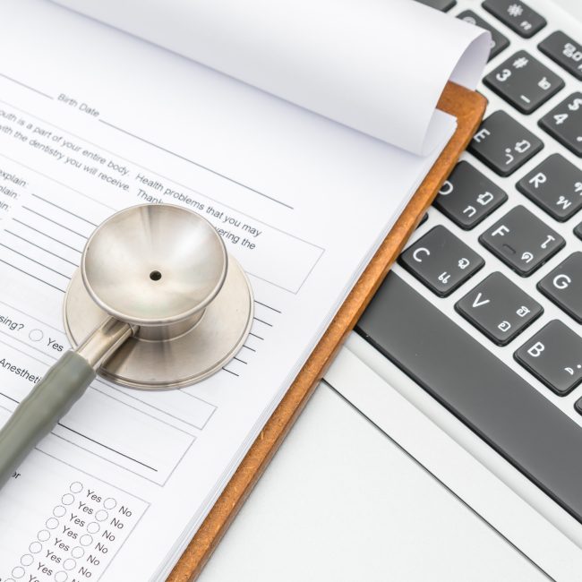 Retirees reviewing an integrated health care and financial planning strategy with a financial advisor in Southwest Florida.