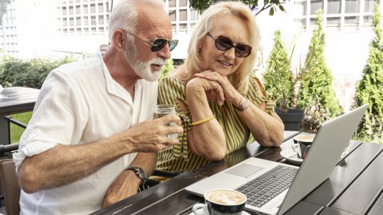 Retirees reviewing an advanced retirement income planning strategy with a financial advisor in Southwest Florida.