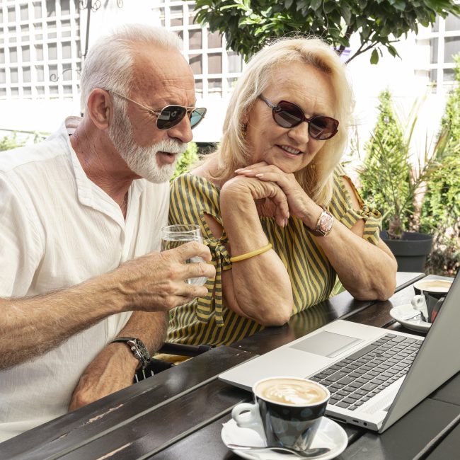 Retirees reviewing an advanced retirement income planning strategy with a financial advisor in Southwest Florida.