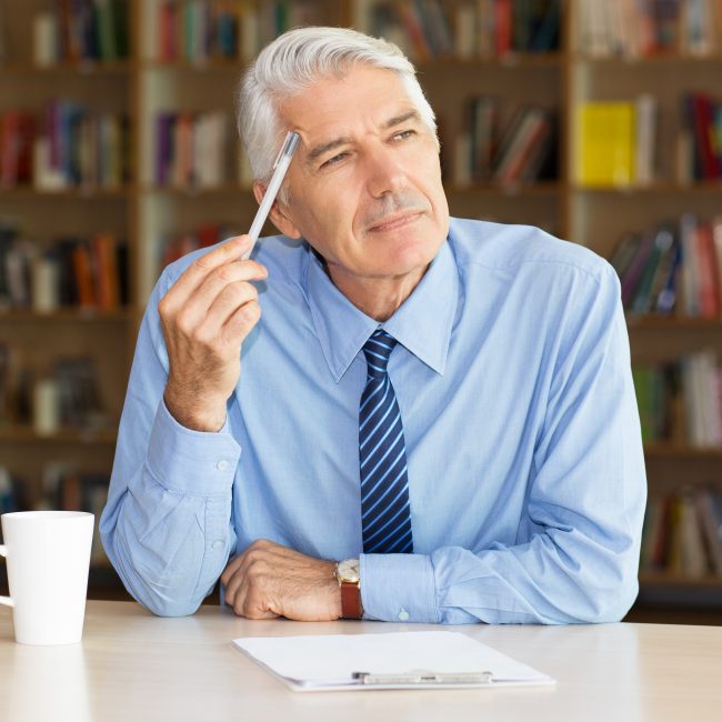 Retirees reviewing advanced retirement tax planning strategies with a financial advisor in Southwest Florida.