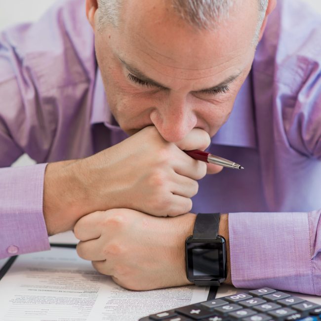 Financial advisor reviewing a comprehensive wealth management plan with clients in Southwest Florida.