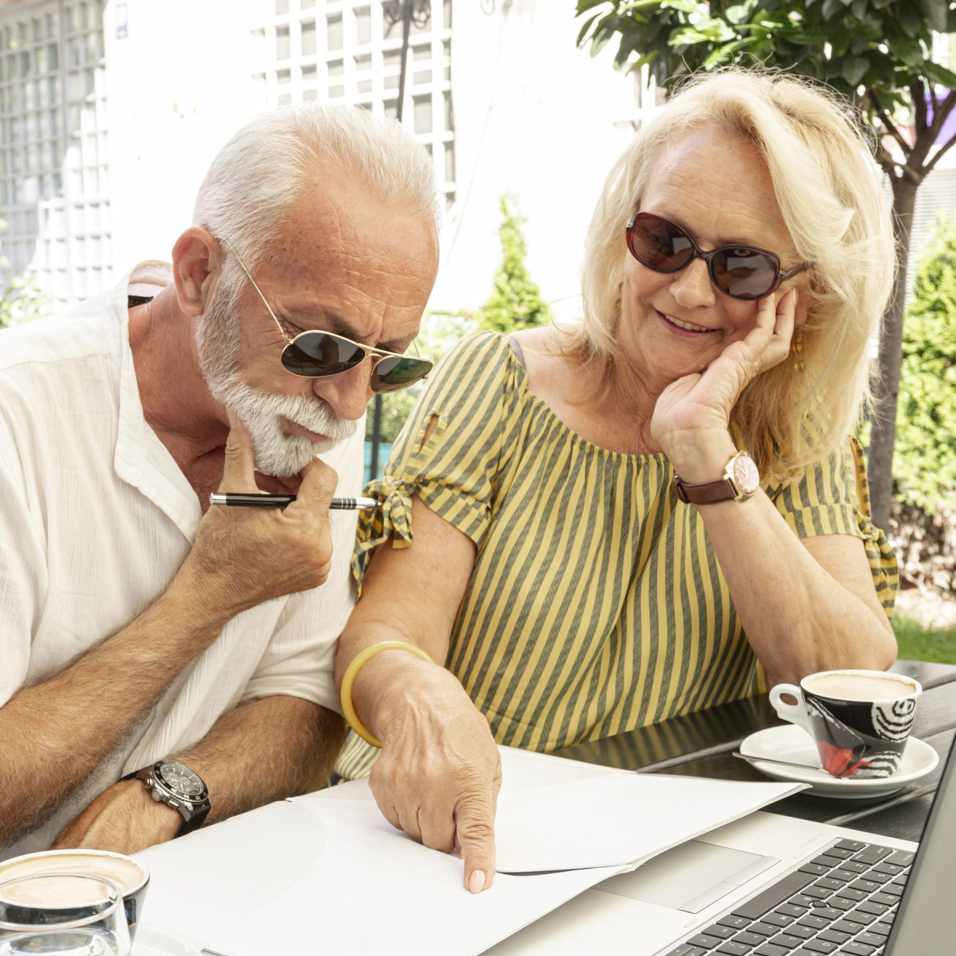 Retirees reviewing a retirement income plan with a financial advisor in Southwest Florida during changing economic conditions.