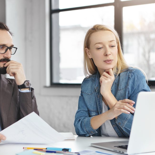 Clients discussing retirement tax planning questions with a financial advisor in Southwest Florida.