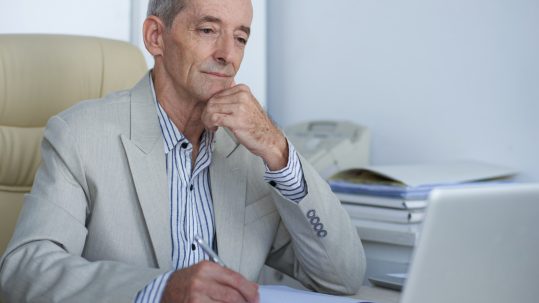 Federal employee reviewing retirement planning options with a financial advisor in Southwest Florida.