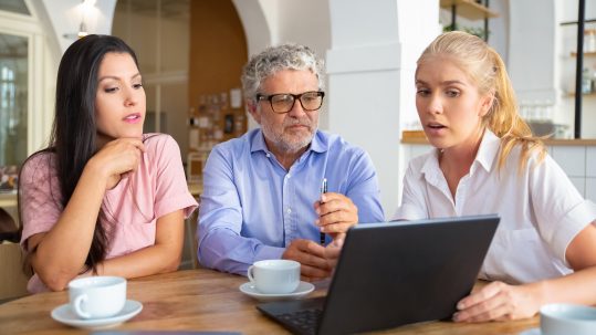 Beginner reviewing retirement tax planning basics with a financial advisor in Southwest Florida.