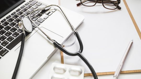 Retirees reviewing health care retirement planning options with a financial advisor in Southwest Florida.