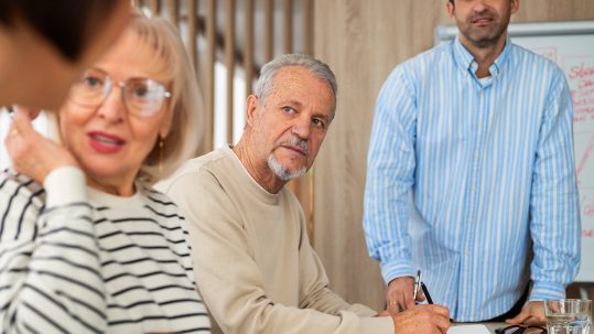 Family discussing retirement tax planning decisions with a financial advisor in Southwest Florida.