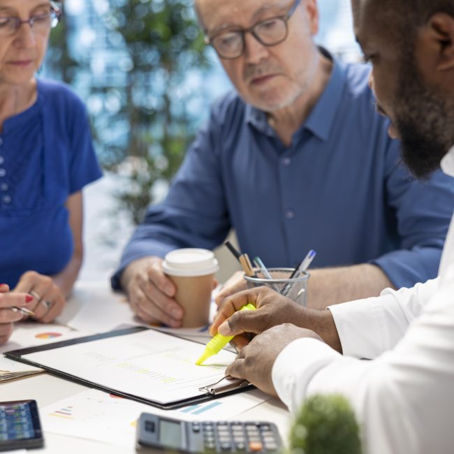 Pre-retiree reviewing wealth management and retirement planning options with a financial advisor in Southwest Florida.