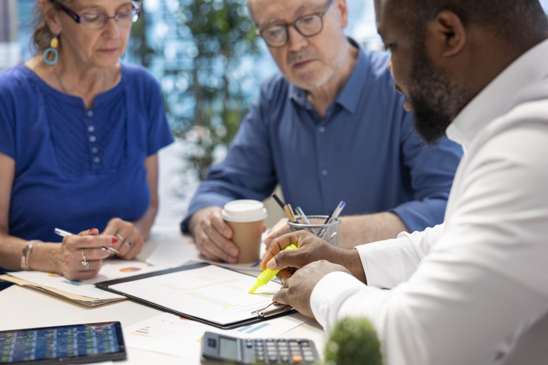 Pre-retiree reviewing wealth management and retirement planning options with a financial advisor in Southwest Florida.
