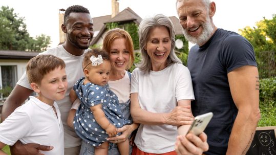 Financial advisor discussing long-term wealth management planning across different life stages with clients in Southwest Florida.