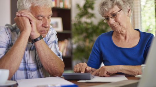Financial advisor explaining retirement tax planning mistakes to a client in Southwest Florida.