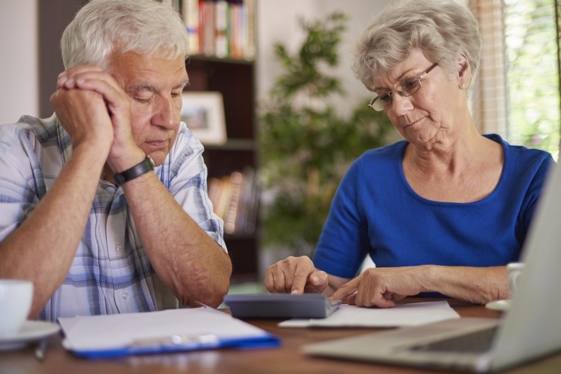 Financial advisor explaining retirement tax planning mistakes to a client in Southwest Florida.