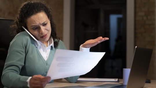 Federal employee reviewing retirement planning documents with a financial advisor in Southwest Florida.