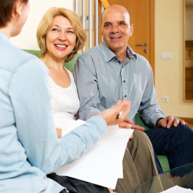 Financial advisor discussing retirement income planning strategies with clients in Southwest Florida.