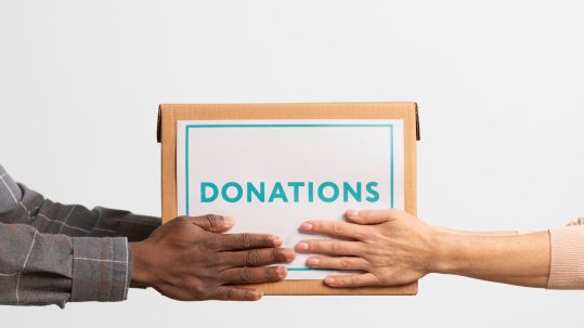 Financial advisor explaining donating appreciated stock vs cash strategy to a client in Southwest Florida