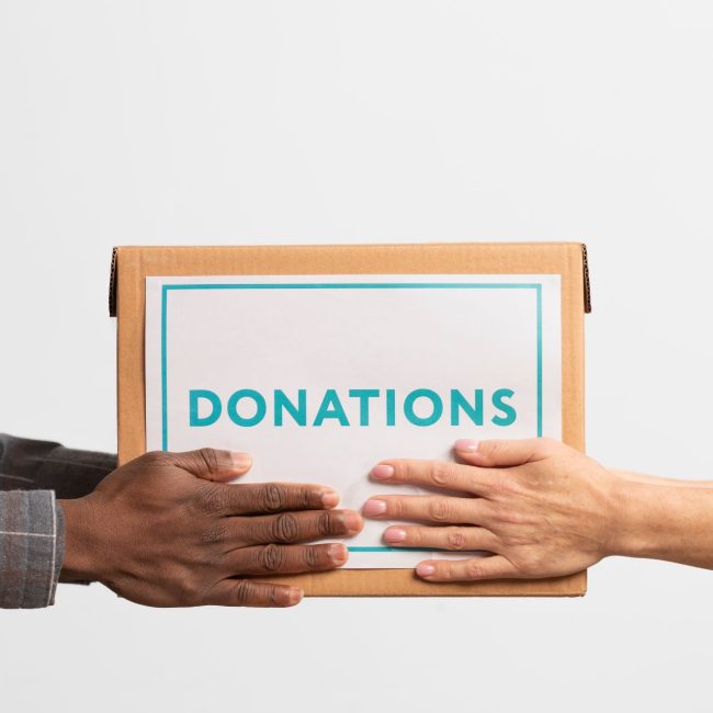 Financial advisor explaining donating appreciated stock vs cash strategy to a client in Southwest Florida