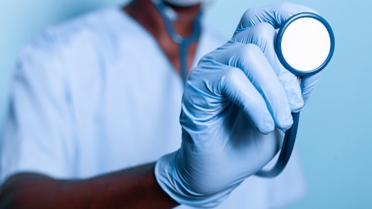 Financial advisor explaining health care retirement planning basics to clients in Southwest Florida.