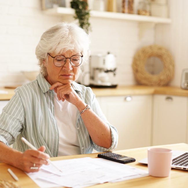 Financial advisor discussing retirement tax planning with a retired couple in Southwest Florida