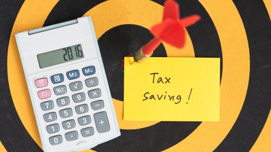 Financial advisor discussing tax strategies for retirees with a client in Southwest Florida