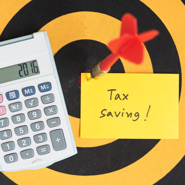 Financial advisor discussing tax strategies for retirees with a client in Southwest Florida