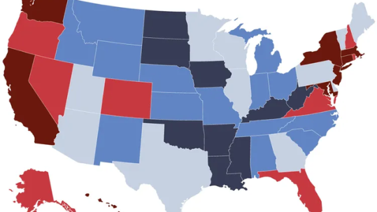 Retired couple reviewing retirement savings goals and state-by-state retirement costs with a financial advisor
