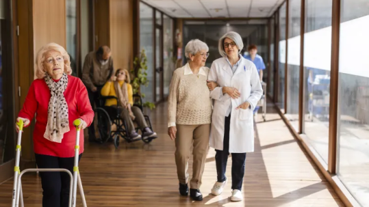 Retired couple meeting with a financial advisor to discuss long-term care insurance and retirement planning