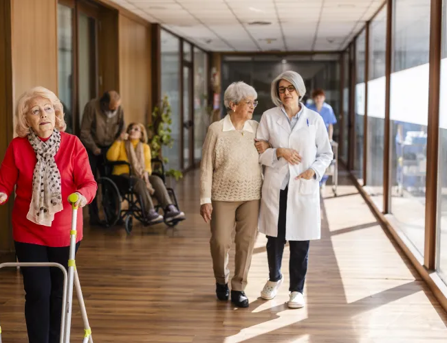 Retired couple meeting with a financial advisor to discuss long-term care insurance and retirement planning