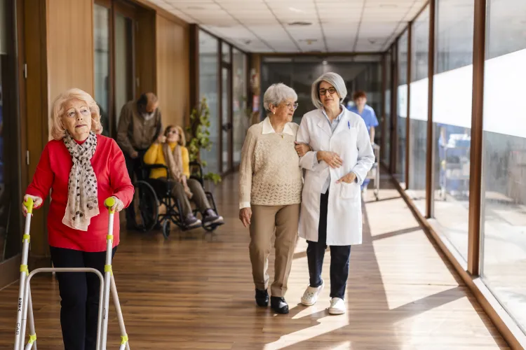 Retired couple meeting with a financial advisor to discuss long-term care insurance and retirement planning