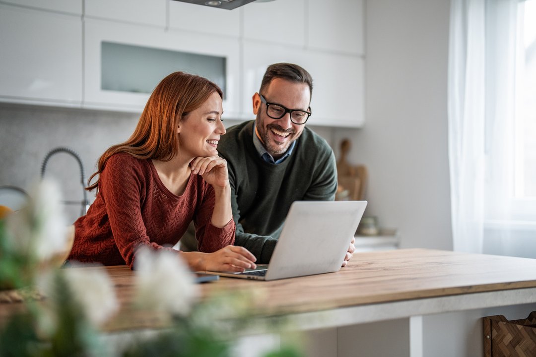 Married couple reviewing retirement accounts and 401(k) contribution strategies with a financial advisor