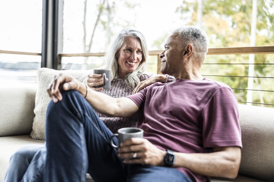 Retired couple discussing the emotional side of retirement planning with a financial advisor