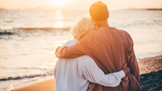 Retired couple reviewing IRA distribution and RMD planning with a financial advisor