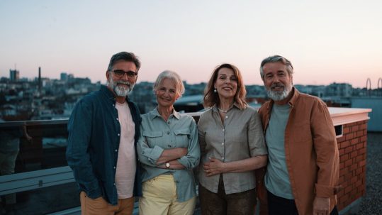 Retired couple reviewing Roth IRA and retirement tax planning strategies with financial advisor
