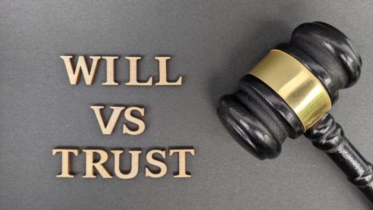 Family meeting with advisor and attorney discussing trust planning and estate planning goals