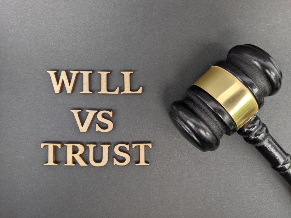 Family meeting with advisor and attorney discussing trust planning and estate planning goals