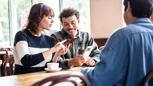 Couple meeting with a financial advisor to review retirement savings and long-term financial goals.