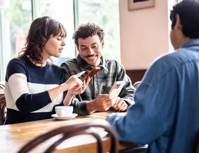 Couple meeting with a financial advisor to review retirement savings and long-term financial goals.