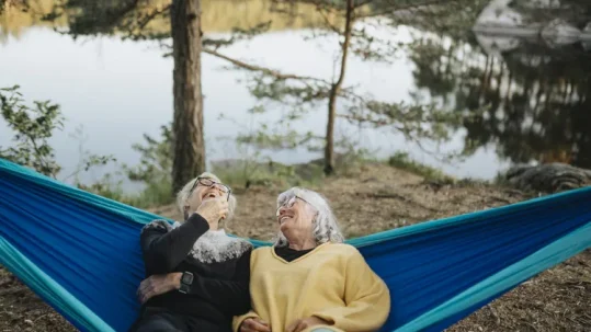 Couple meeting with a financial advisor to discuss retirement savings, retirement income, and long-term financial planning.